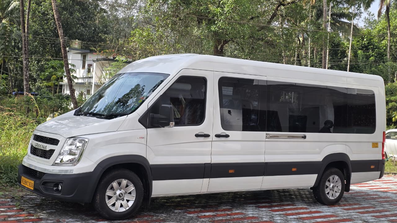 Side view of the white 16 seater Force Urbania van